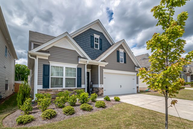 a home with a manicured front lawn